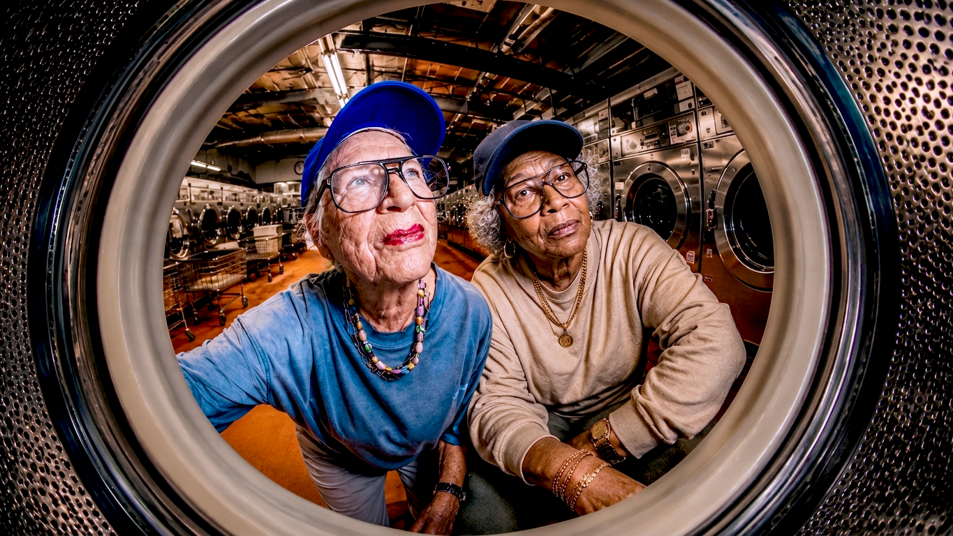 Marie and Loretta together inside a laundromat dryer
